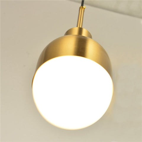 Pendant Light with Frosted Glass Globe and Polished Brass Finish