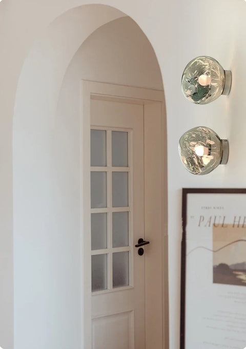 Glass Wall Sconce with Metal Frame and Sculptural Shade — product view