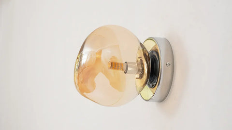 Glass Wall Sconce with Metal Frame and Sculptural Shade — product view