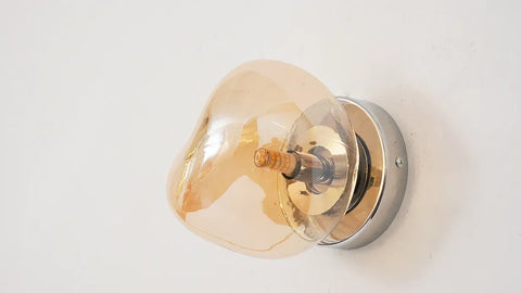 Glass Wall Sconce with Metal Frame and Sculptural Shade — product view