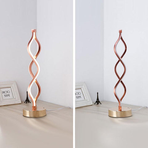 Sculptural Gold LED Table Lamp with Twisted Loop Design and Integrated Lighting
