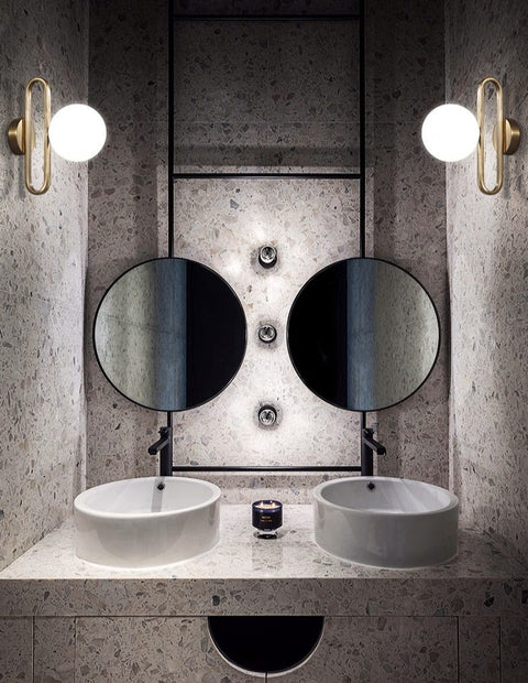 Wall Sconce with Frosted Glass Globe and Brushed Metal Loop Frame