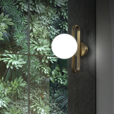 Wall Sconce with Frosted Glass Globe and Brushed Metal Loop Frame