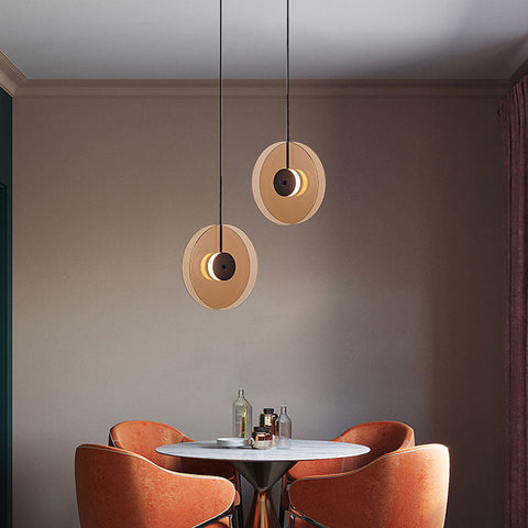 LED Pendant Light with Layered Glass Discs and Warm Ambient Lighting